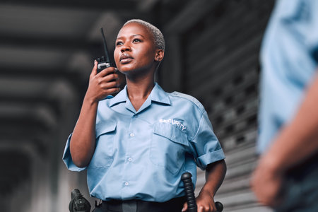 A security officer communicating by radio